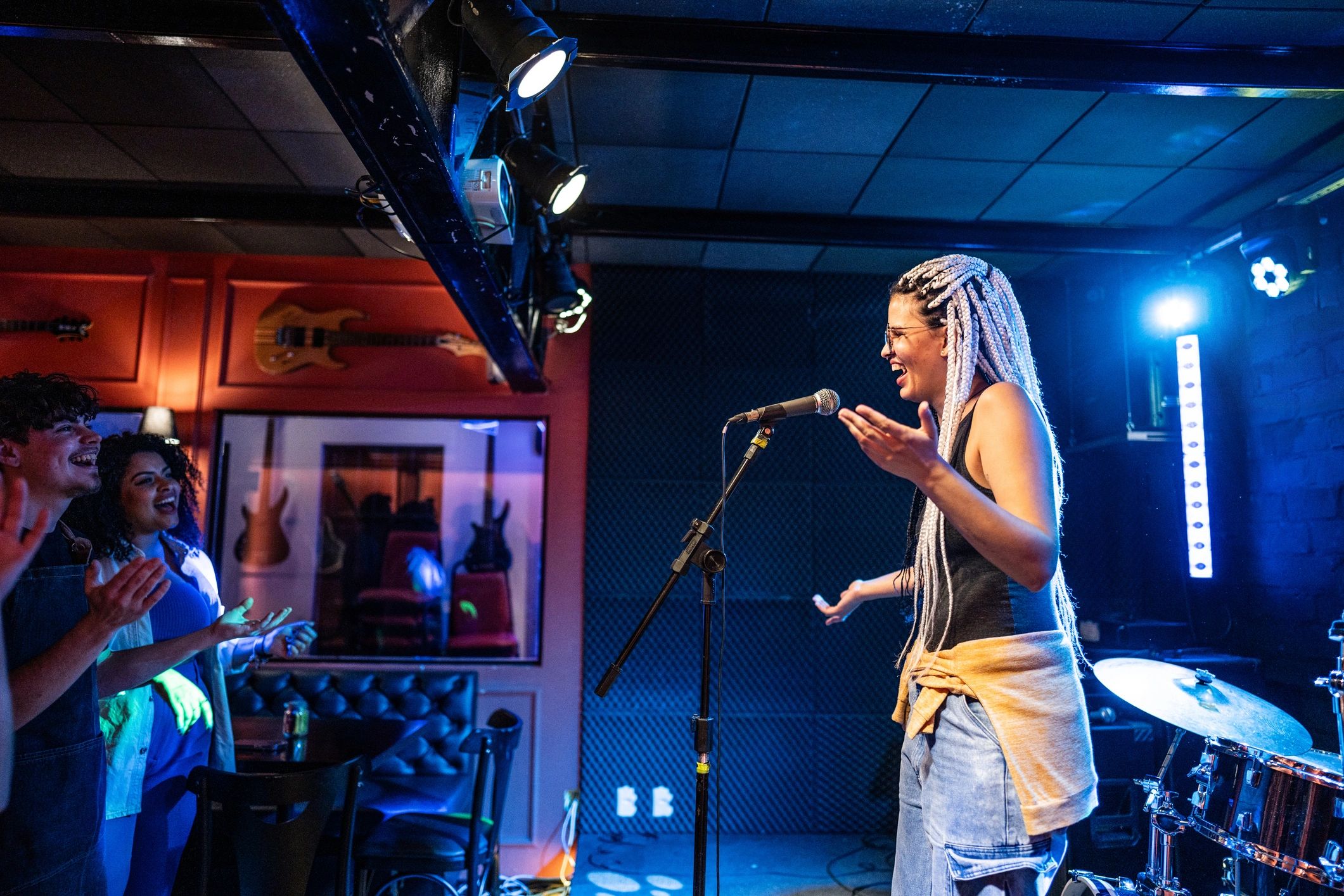Young woman talking during stand-up comedy show